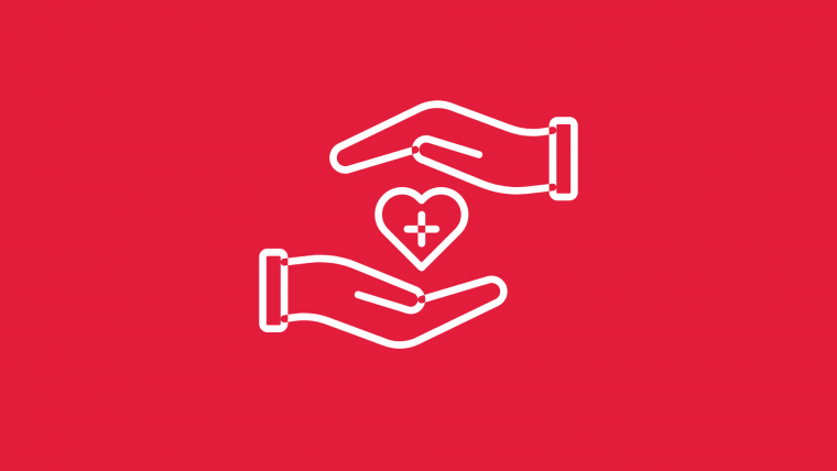 Två händer med ett hjärta mellan sig